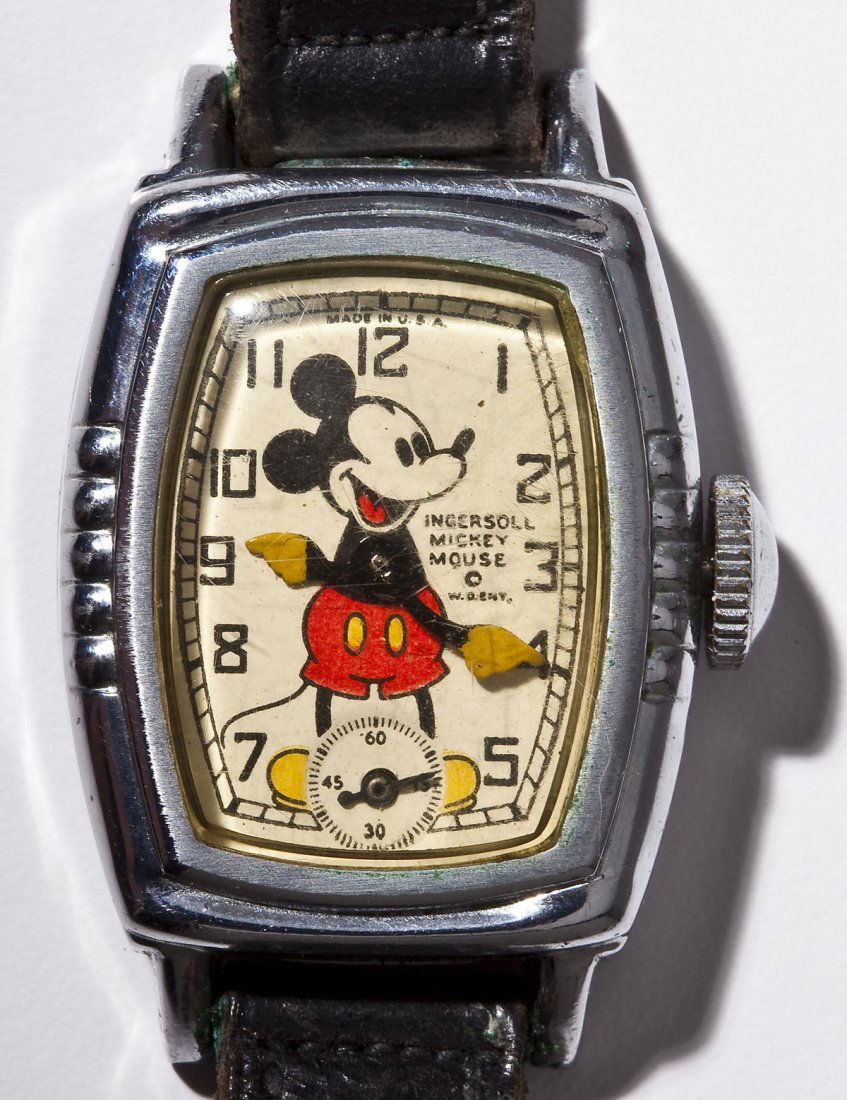 Vintage Ingersoll Mickey Mouse Wristwatch: DESCRIPTION: Vintage Mickey Mouse wristwatch by Ingersoll. White dial with subsidiary seconds and image of Mickey marked "Ingersoll Mickey Mouse W. D. Ent. Made in U.S.A." Movement serial #6789264. Bl