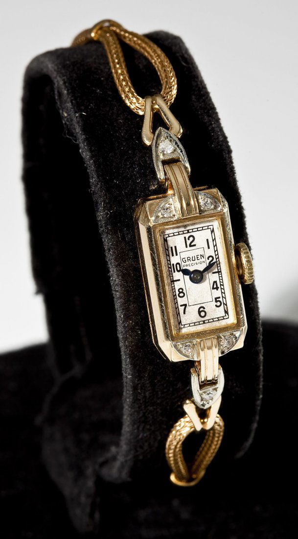 Lady's Gruen 14K & Diamond Wristwatch: DESCRIPTION: Lady's Gruen wristwatch. White dial with black numerals, blued hands, marked "Gruen Precision". Movement marked "Gruen Watch Co. Precision 17 Seventeen Jewels Switzerland Unadjusted 32036
