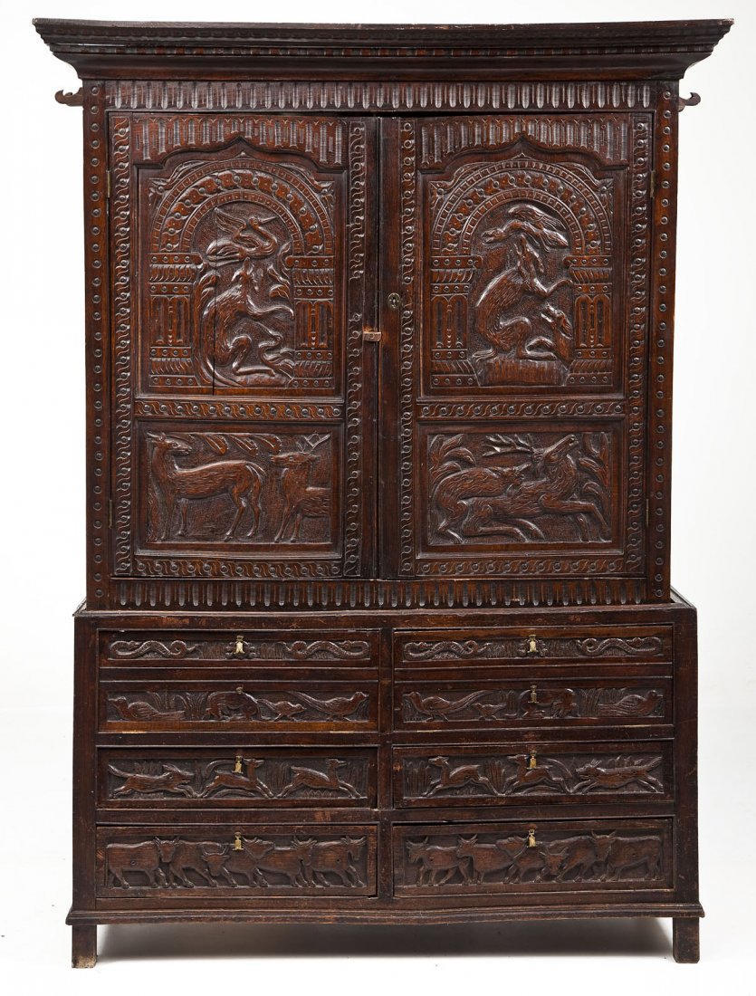 English Jacobean Linen Press: DESCRIPTION: An English Jacobean Oak Linen Press. Elements dating from the 17th century but probably re-assembled and re-used wood. The form consisting of a double door cupboard resting on six paneled