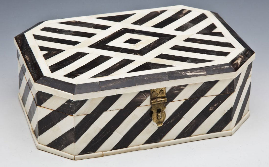 Bone & Ebony Veneered Box: DESCRIPTION: An octagonal box with geometric bone and ebony veneer. Brass clasp. MEASUREMENTS: 10" x 7-1/1" x 3-1/4" high. CONDITION: Interior and base repainted.