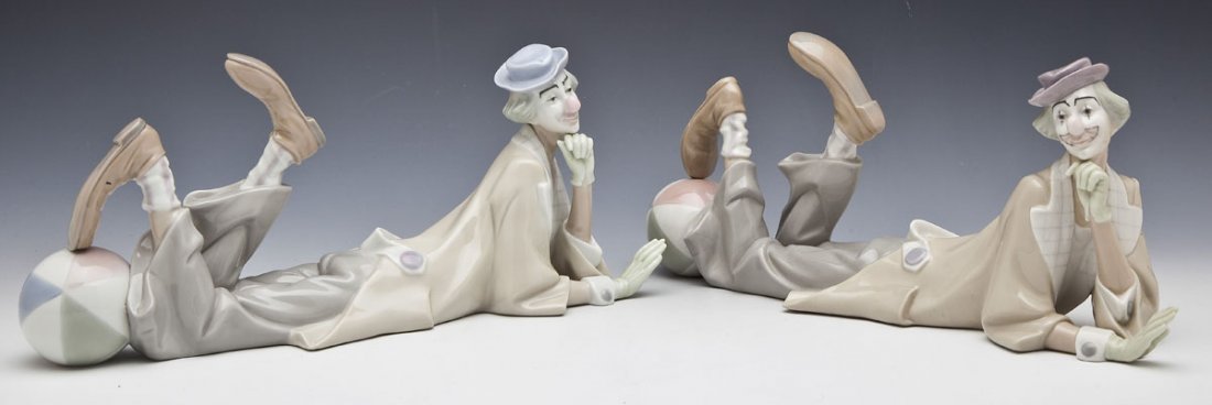 Pair of Lladro Clowns with Balls #4618: DESCRIPTION: Pair of Lladro Clown with Ball figures. Number 4618. Each with hat and beach ball, with head propped on left hand. Issued in 1970. Retired in 1992. Marked underneath for Lladro. MEASUREME