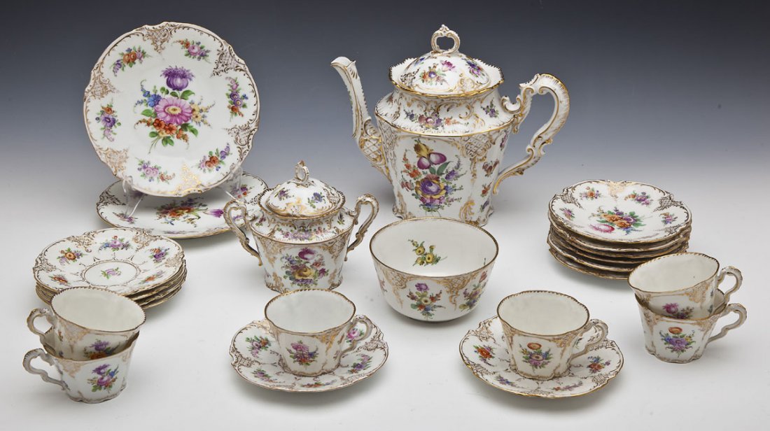 23 Pc Dresden Coffee Set: DESCRIPTION: Twenty-three piece Dresden tea set. Floral painted pattern with gilt details. Includes: six each of 5-7/8" bread and butter plates, 5-7/8" saucers, 2-1/4" teacups, two 7-3/4" dessert plat