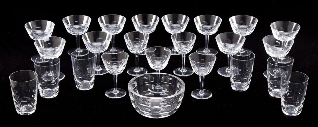 23 Pcs Orrefors Glassware with Bowl: DESCRIPTION: Twenty-three piece Orrefors glassware set. Includes: twelve 5-1/8" sorbet glasses, six 4-3/4" tumblers, five 5-3/8" wine glasses. With one 6-7/8" diameter x 3-5/8" high bowl. Glasses mark