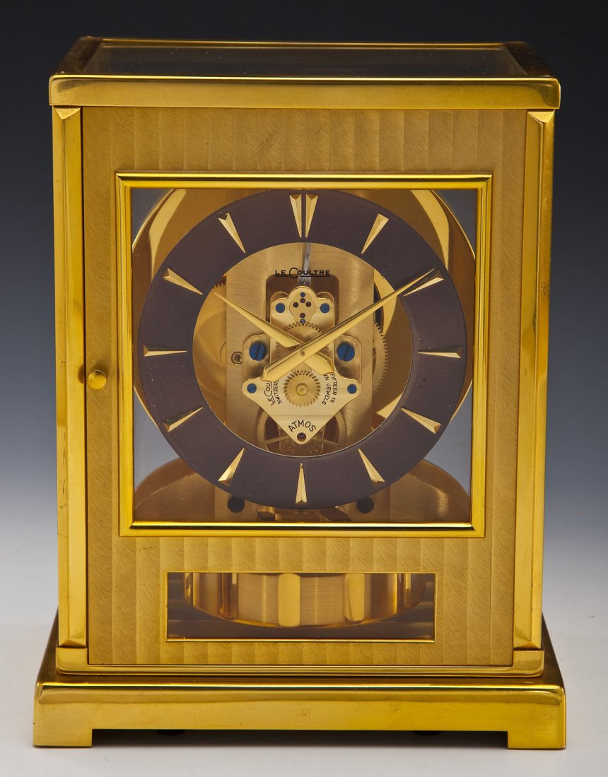 1950s LeCoultre Atmos Tuxedo Brass Mantle Clock: DESCRIPTION: LeCoultre Atmos tuxedo brass mantle clock. 15 jewels. Serial number 63530. Circa 1950s. Dark face with dagger marks for numbers. Marked for LeCoultre Switzerland, "Fifteen 15 VXN Jewels",