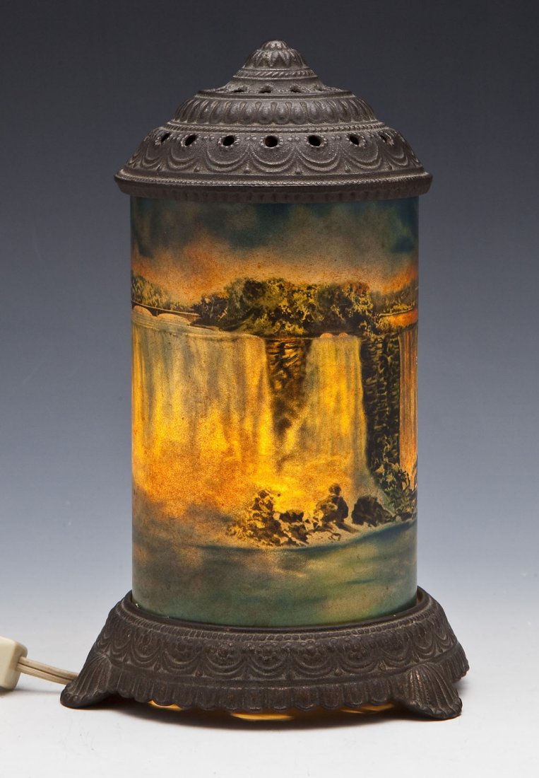 Niagara Falls Motion Lamp: DESCRIPTION: Niagara Falls Motion Lamp by Scene in Action. Electrical component marked "Gilbert New York City MADE IN USA". Top brass shell lifts off to reveal interior mechanisms. MEASUREMENTS: 8-3/4