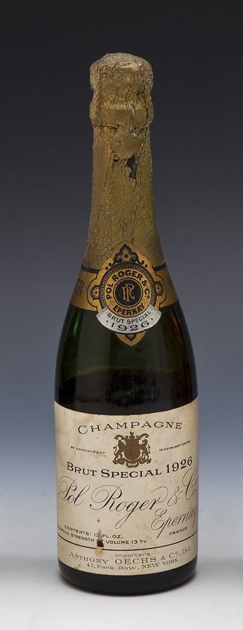 Pol Roger Brut Special 1926 Champagne: DESCRIPTION: Pol Rogers Brut Special 1926 from Epernay, France. MEASUREMENTS: 13 fl oz bottle. CONDITION: Heavy sedimentation. Water damage, fading and tearing of labels. Losses to foil around neck. E