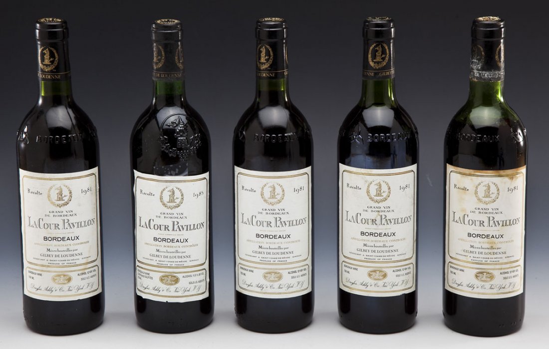 5 Unopened Bottles of "La Cour Pavillon" Bordeaux: DESCRIPTION: Five unopened bottles of La Cour Pavillon Bordeaux. Four 1981 vintages and one 1985 vintage. "Grand Vin De Bordeaux Misen bouteilles par Gilbey De Loudenne." Product of France. All bottle