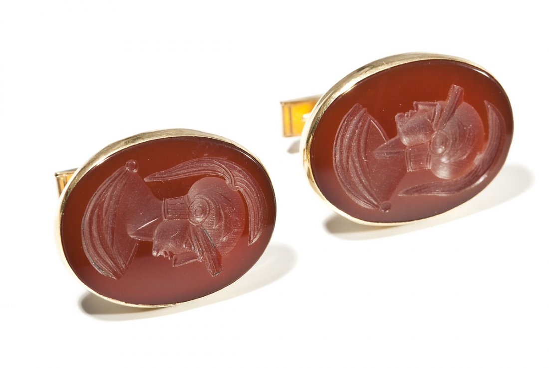 Pair of 14K & Itaglio Cufflinks: DESCRIPTION: Pair of marked 14K yellow gold cufflinks each with an oval carnelian intaglio of a Roman soldier. MEASUREMENTS: Tops 1-1/6" x 13/16". 10.6 dwt (16.5 gr). CONDITION: No defects noted.
