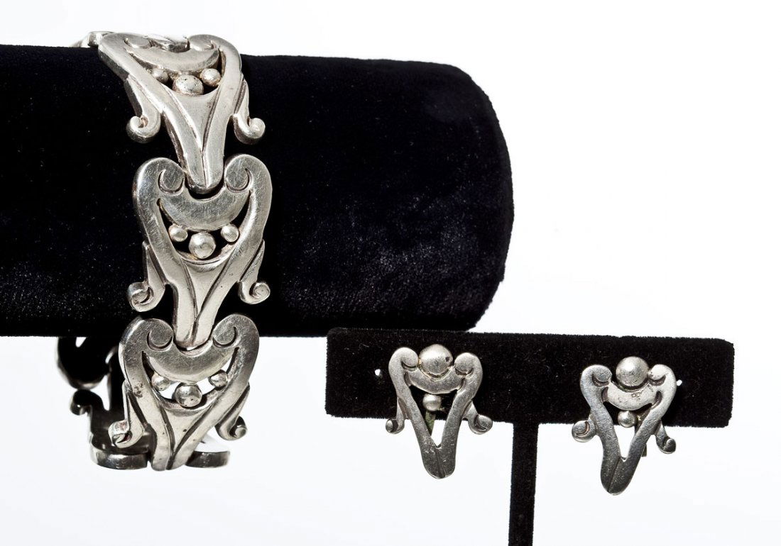 Los Ballesteros Bracelet & Earrings Set: DESCRIPTION: Los Ballesteros Mexican sterling bracelet and earrings set. Bracelet comprised of seven ornate scroll and ball motif open work links. Unmarked. Matching screwback earrings. One marked "St