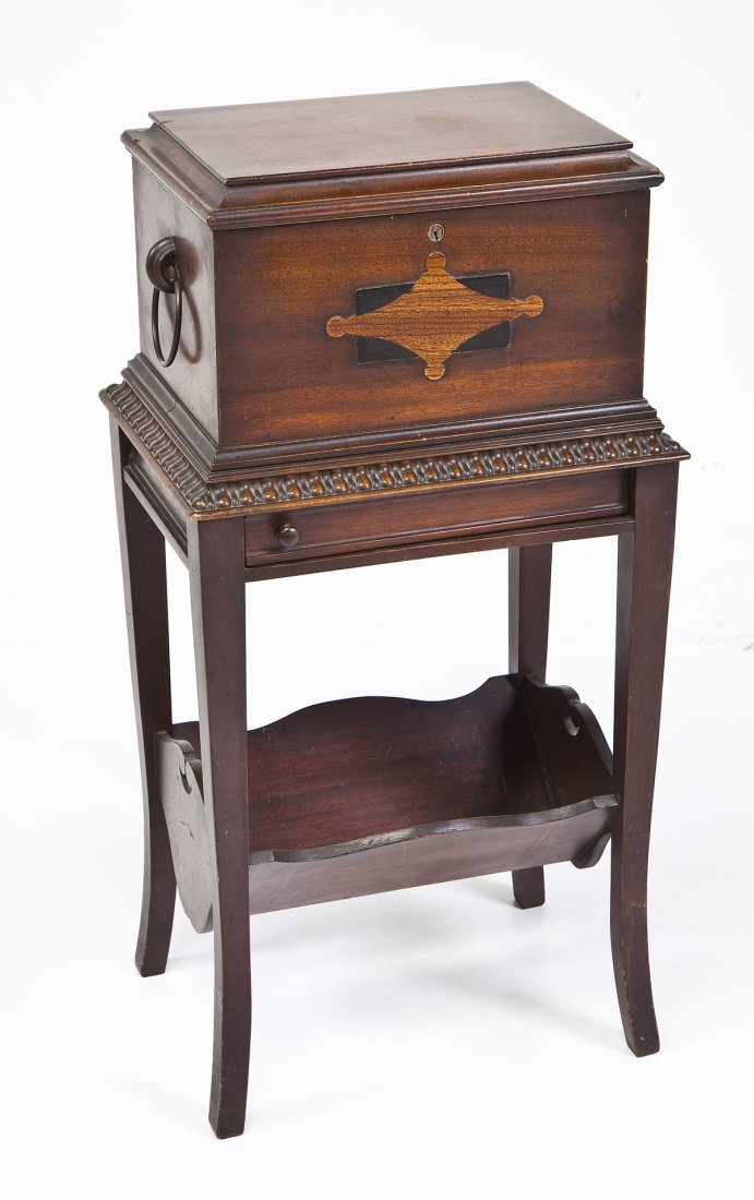 Inlaid Wood Humidor: DESCRIPTION: Humidor stationed above a V-shaped magazine rack. Humidor at top with two ring handles and front with wood inlay. Interior of humidor lined with white porcelain. With swing out glass asht