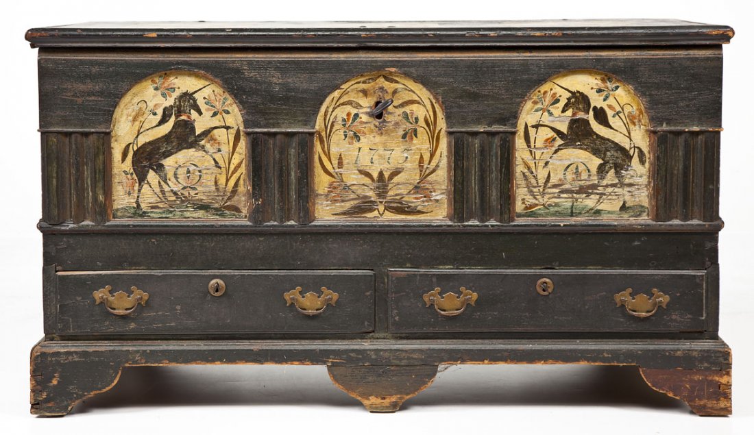 Unicorn Decorated Blanket Chest: DESCRIPTION: Blanket chest with black painted finish and two drawer base decorated to lift lid with three panels of tulips. The front with central arched panel dated "1775" with lock flanked by two ar