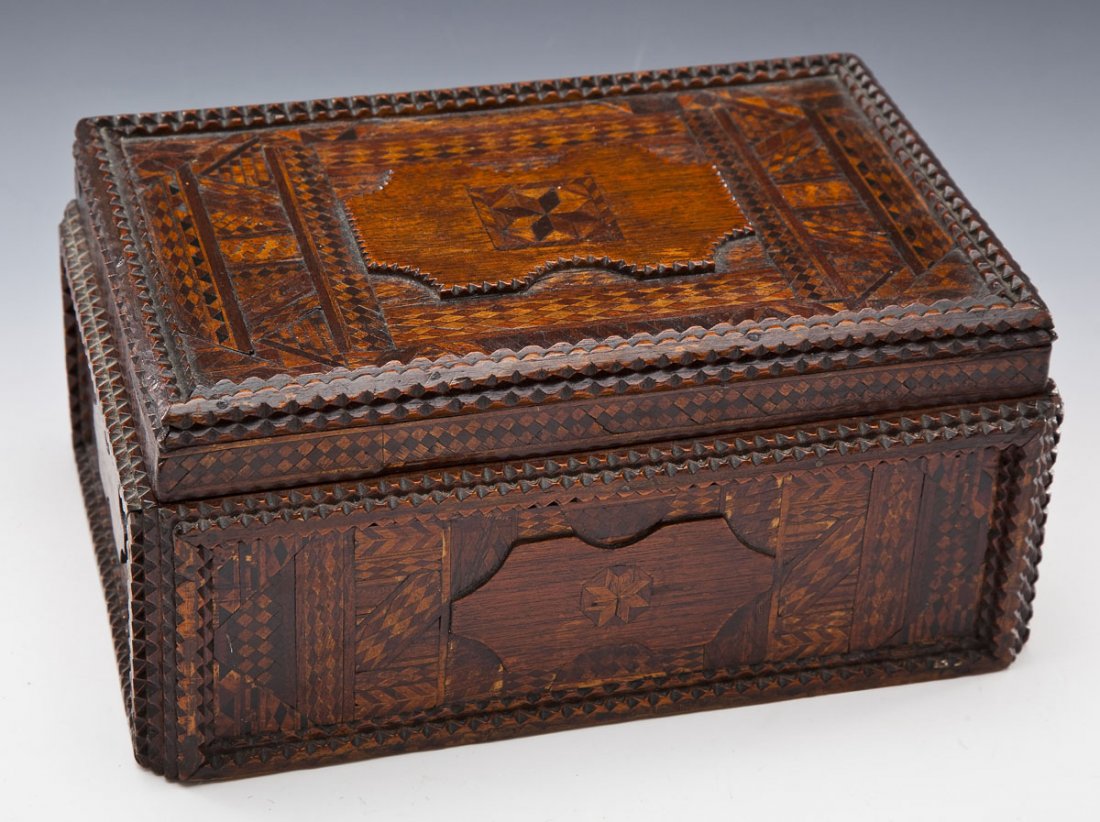 Tramp Art Inlaid Wooden Box with Quilted Interior: DESCRIPTION: Tramp art inlaid wooden box with quilted interior. MEASUREMENTS: 12" length x 5-1/2" tall x 8" deep. CONDITION: Interior lining separating from box. Some inlay lifting or missing.