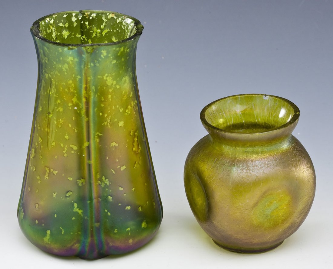 2 Green Loetz-Type Art Glass Vases: DESCRIPTION: Two green Loetz-type art glass vases including: 1) 5-1/2" iridescent ribbed beaker vase. 2) 3-1/2" iridescent pinch vase with crackle. MEASUREMENTS: See Description. CONDITION: Minor chip