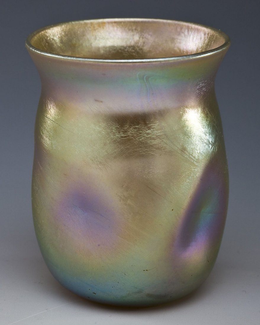 LCT Tiffany Gold Favrile Glass Toothpick Holder: DESCRIPTION: Tiffany gold favrile glass toothpick holder with flared rim and pinched sides. Signed "LCT" on base. MEASUREMENTS: 2-1/2" tall. CONDITION: No defects noted.