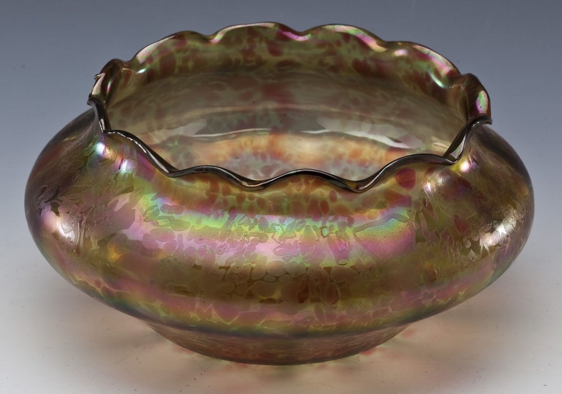 Loetz-Type Art Glass Bowl: DESCRIPTION: Iridescent Loetz-type art glass bowl. Bulb-shaped with scalloped edge. MEASUREMENTS: 7-1/2" diameter x 3-1/2" tall. CONDITION: Natural bubble on underside of base and on lip.