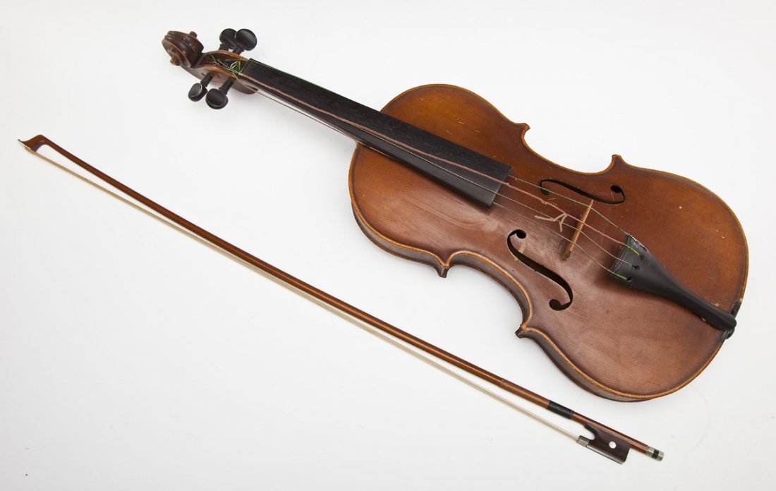Czechoslovakian Copy of Stradivarius Violin: DESCRIPTION: Cezchoslovakian copy of an Antonius Stradivarius violin. With bow and bridge. Marked on label inside "Copy of Antonius Stradivarius Made in Czecho-Slovakia". MEASUREMENTS: Violin 26". Bow
