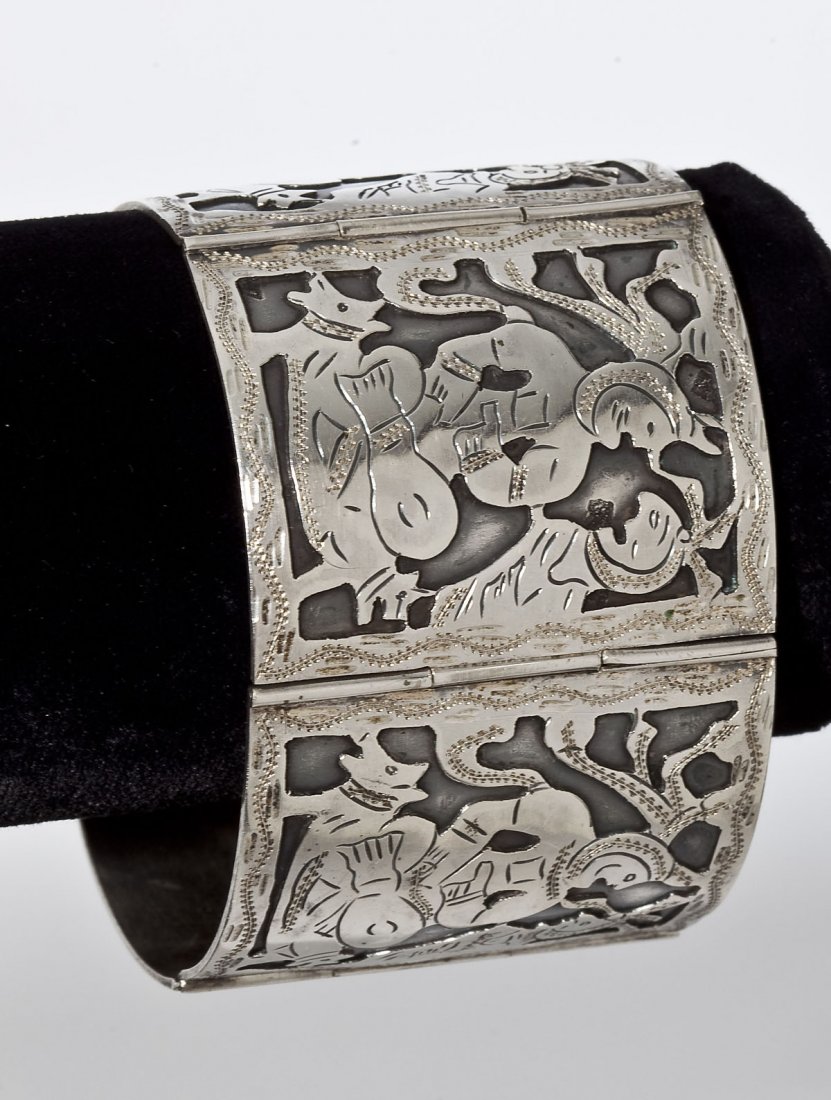 Guatemalan 800 Silver Figural Bracelet: DESCRIPTION: Gautemalan 800 silver bracelt of five links each depicting a Mayan figure on a throne with two dog heads. Marked "800 Guatemala". MEASUREMENTS: 7" long x 1-3/4" wide. CONDITION: No defect