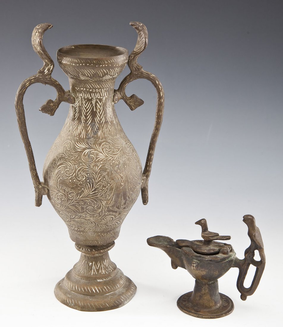 2 Eastern Metal Vessels incl Lamp & Vase: DESCRIPTION: Two Middle Eastern metal vessels. Includes: 1) 4" tall bronze Khorasan oil lamp with two small birds. Small engraved letters on foot. Similar to 11th century examples. 2) 9-7/8" tall bras