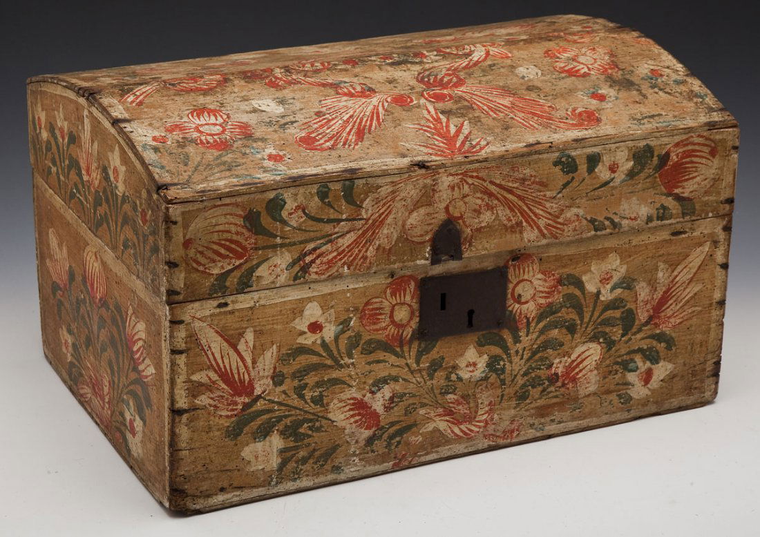 Dome Top Wooden Box: DESCRIPTION: Dome top wooden box. Decorated throughout in red, green, and white flowers. MEASUREMENTS: 19" x 13" x 11-1/4" high. CONDITION: Woodworm holes throughout. Edge wear throughout. Darkening a