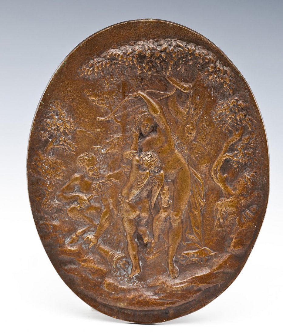 Bronze Plaque of Venus and Cupid After Corregio: DESCRIPTION: Bronze plaque of Venus taking Cupid bow after a painting by Correggio. Forrest scene with satyr creeping in the background steals Cupid's quiver. Hanging loop on reverse. MEASUREMENTS: 7-
