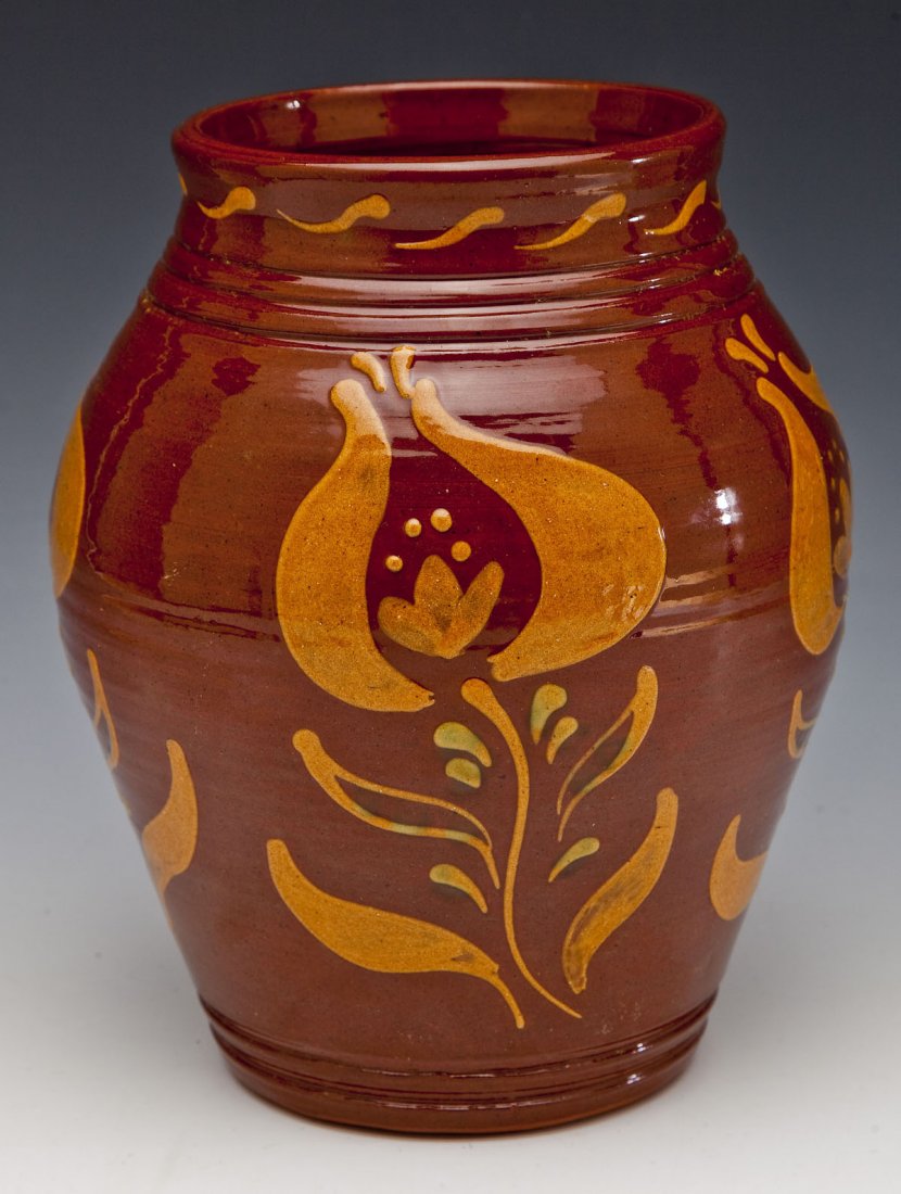 Ned Foltz Redware Jar with Slip-Painted Florals: DESCRIPTION: Ned Foltz redware jar with slip-painted florals. Signed on underside "Foltz Pottery P 1985". MEASUREMENTS: 9-1/4" tall x 7" at widest point. CONDITION: Miniscule wear consistent with use