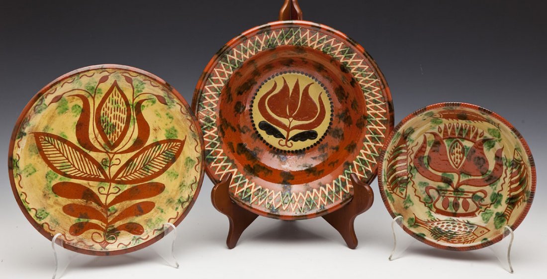 3 Pcs James C. Seagreaves Redware: DESCRIPTION: Three pieces James C. Seagreaves redware. Includes: 1) Bowl with center of yellow and black flower with dotted border. Cross-hatched rim in yellow with green dots. 11-1/2" diameter x 3-3/