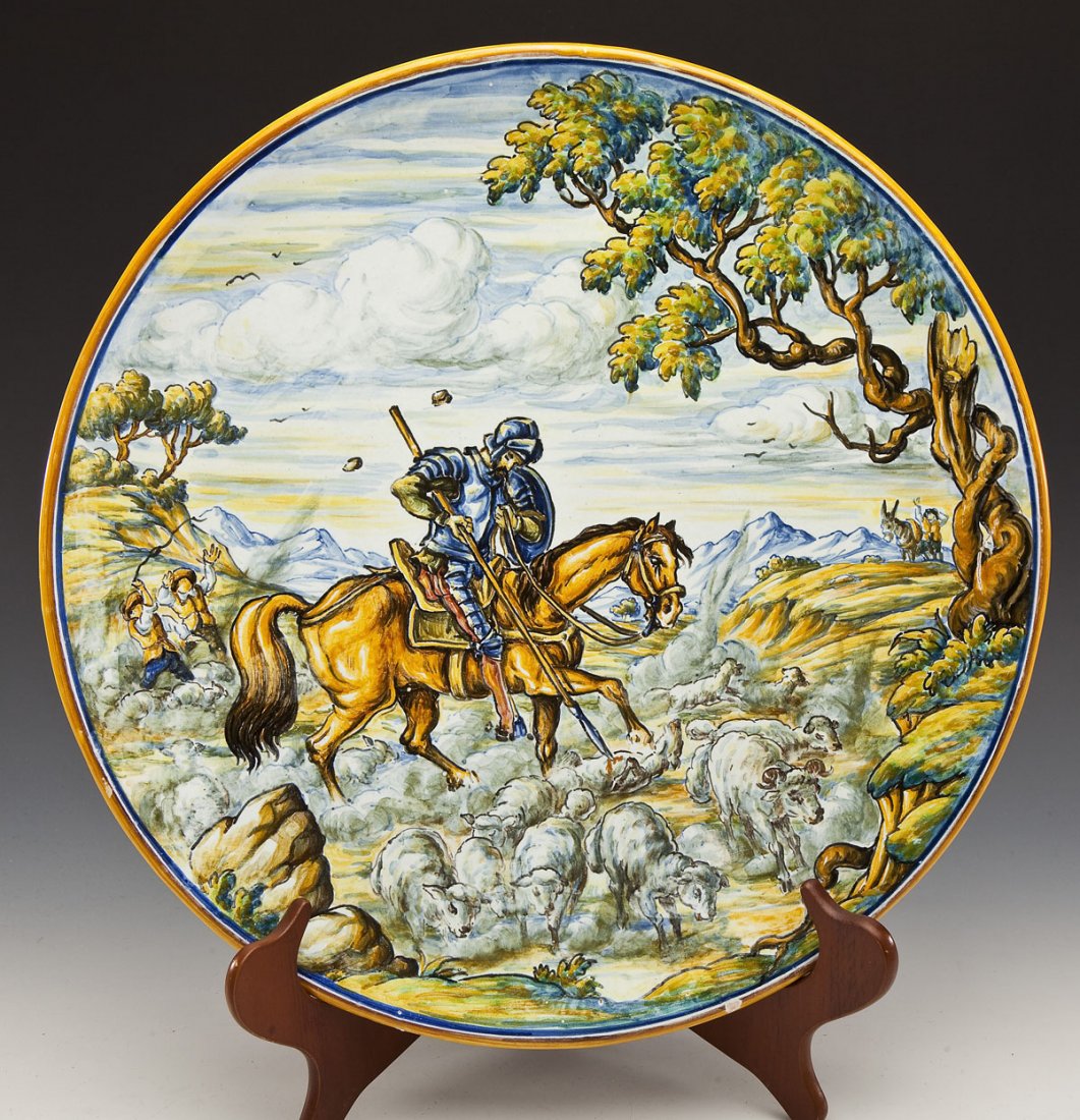 AC Duran Italian Majolica Plate: DESCRIPTION: Italian majolica plate, hand painted with scene of Don Quixote being stoned by shepherds. Signed on back "AC Duran" and "Alaea". MEASUREMENTS: 16-3/8" diameter. CONDITION: Loss to color g