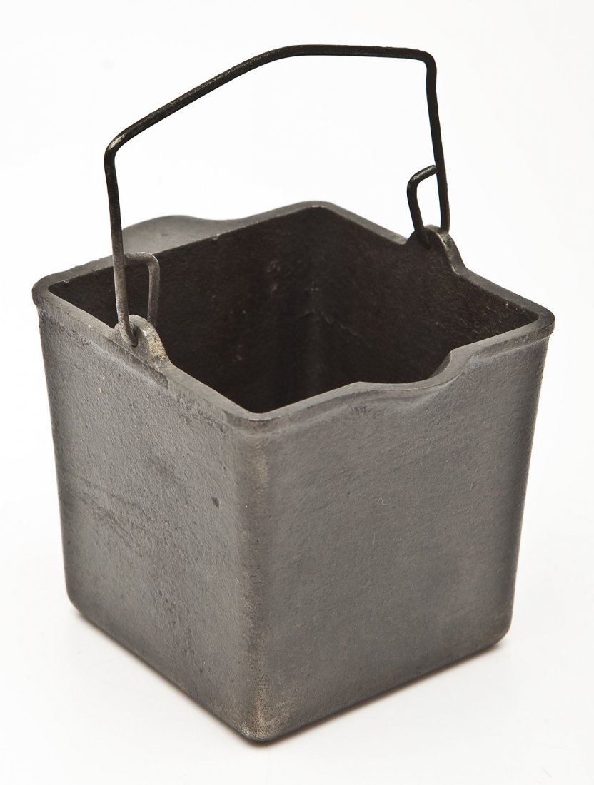 Griswold Grease Receptacle: DESCRIPTION: Griswold Grease Receptacle. Catalog/Part No: 1482. MEASUREMENTS: 4-3/4" long. CONDITION: Minor wear as expected with age.