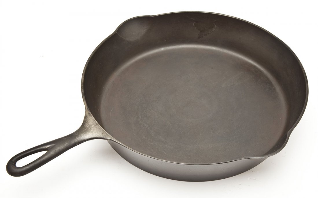 Griswold No. 11 Skillet Outside S/R, 6th Series: DESCRIPTION: Griswold No.11 Skillet, ERIE, Outside S/R, 6th Series. Catalog/Part No: None. MEASUREMENTS: 17-1/4" long. CONDITION: No defects noted.