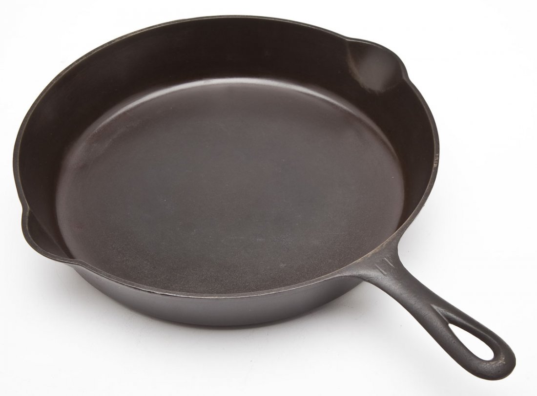 Griswold No. 11 Block Logo Skillet: DESCRIPTION: Griswold No. 11, Block Logo, S/R, EPU. Catalog/Part No: 717. MEASUREMENTS: 17-1/4" long. CONDITION: No defects noted.