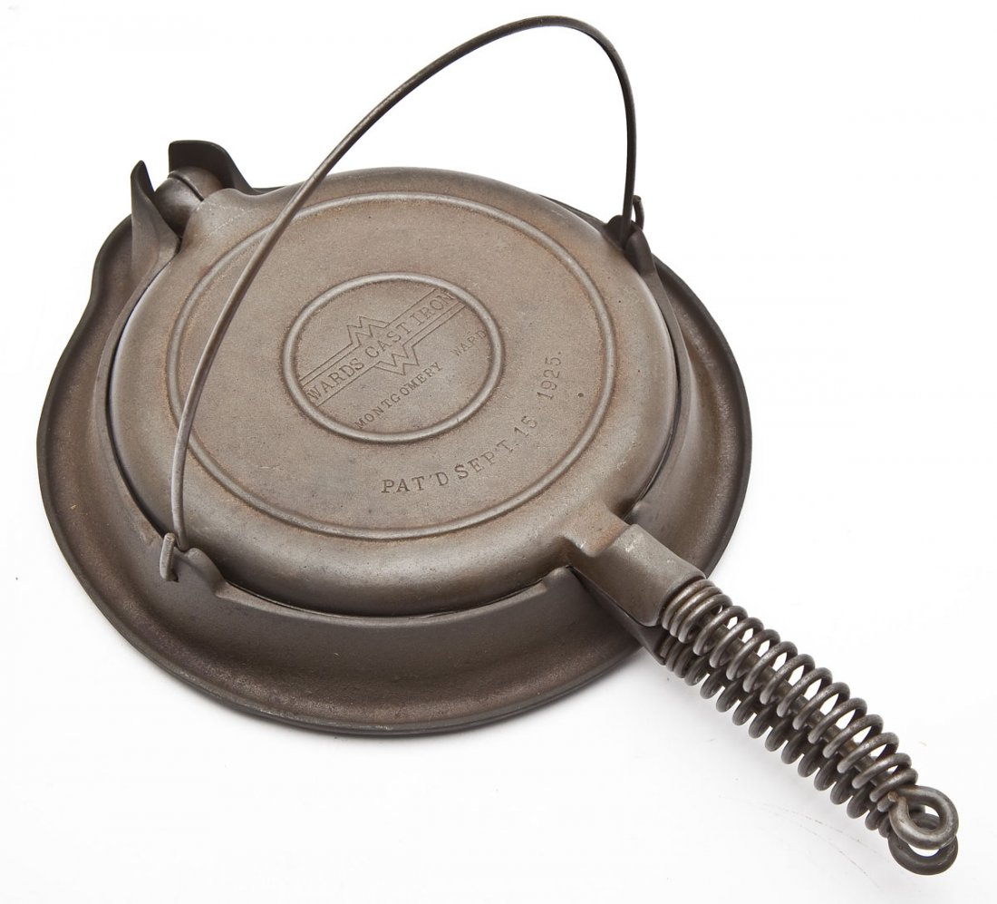 Griswold Montgomery Ward No. 8 Waffle Iron: DESCRIPTION: Griswold Montgomery Ward No. 8 Waffle Iron Alaskan Coil Handles. Catalog/Part No: None. MEASUREMENTS: 15-1/2" long. CONDITION: Minor wear as expected with age.