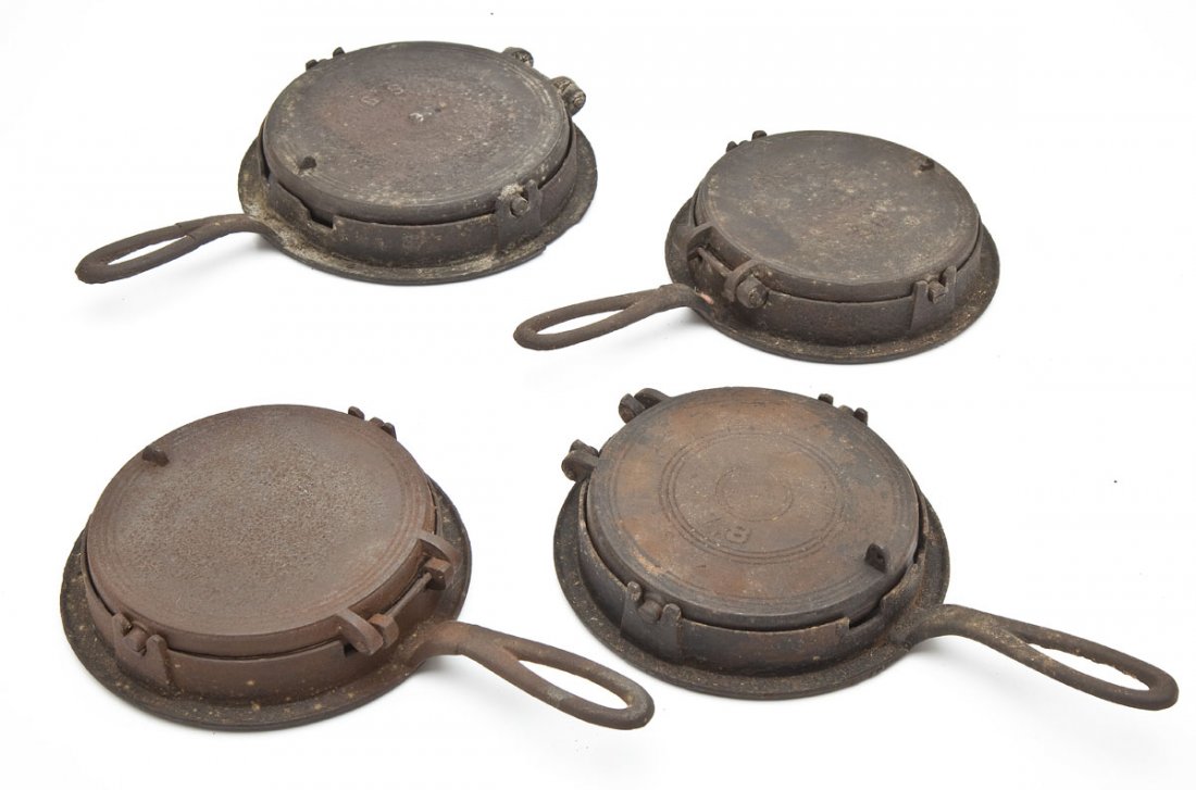 4 Waffle Irons on Bases: DESCRIPTION: Four waffle irons on bases. Includes: 1) 13-1/4" long with "7.8" stamped on lid. Significant wear throughout consistent with use and age, including rusting and pitting. 2) 13-1/4" long wi