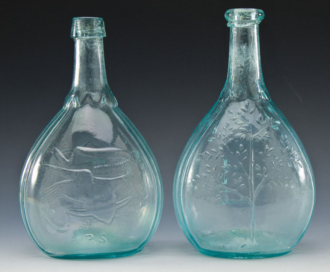 2 Aqua Calabash Flasks: DESCRIPTION: Two aqua calabash flasks. Includes: 1) 8-3/4" tall molded with "ARS", "Union", shaking hands, Masonic compass, bird holding arrows in talons, and banner. Significant roughness to pontil.