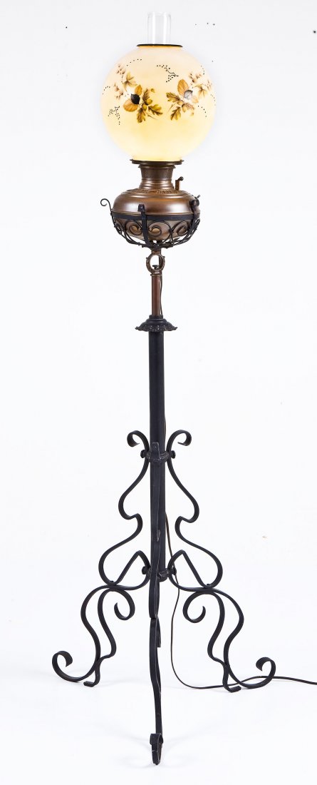Bradley & Hubbard Adjustable Piano Lamp: DESCRIPTION: Bradley and Hubbard wrought iron and brass adjustable piano lamp with transfer printed glass globe. Brass reservoir marked "B&H". MEASUREMENTS: 6-3/4" tall x 20-1/2" at widest point. COND