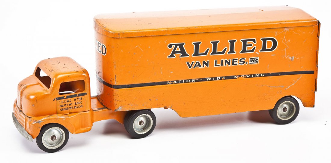 C 1953 Tonka Allied Van Lines Truck: DESCRIPTION: Circa 1953 pressed steel Tonka Allied Van Lines, Inc. semi trailer truck. MEASUREMENTS: 21" x 6" x 8-1/4". CONDITION: Losses to orange paint from use and losses to decal. Loose rear doors