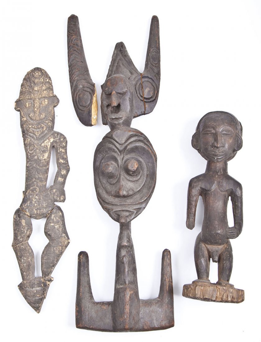 3 Carved African Figures: DESCRIPTION: Three carved African figures. Includes: 1) Carved male figure with protruding stomach, beard, and ornamental headgear on reverse. Apparent losses to base. Minor surface wear. Deep brown p