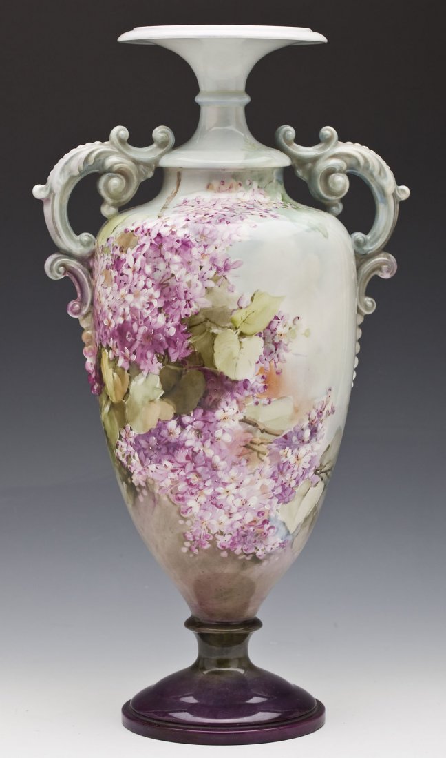 Hand Painted Belleek Amphora with Hyacinth: DESCRIPTION: Hand painted Belleek amphora with light colored hyacinth. Marked "Belleek" on underside of base. MEASUREMENTS: 17-1/4" tall x 9" diameter at widest point. CONDITION: No defects noted.