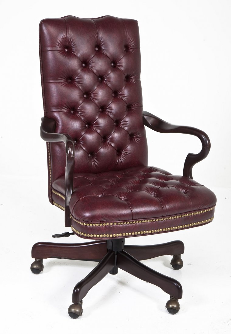 Tufted Leather Swivel Chair by Paoli: DESCRIPTION: A leather upholstered swivel chair made and retailed by the Paoli Company, circa fourth quarter of the 20th century. The tufted leather back and seat resting on spider legs with wheels. P