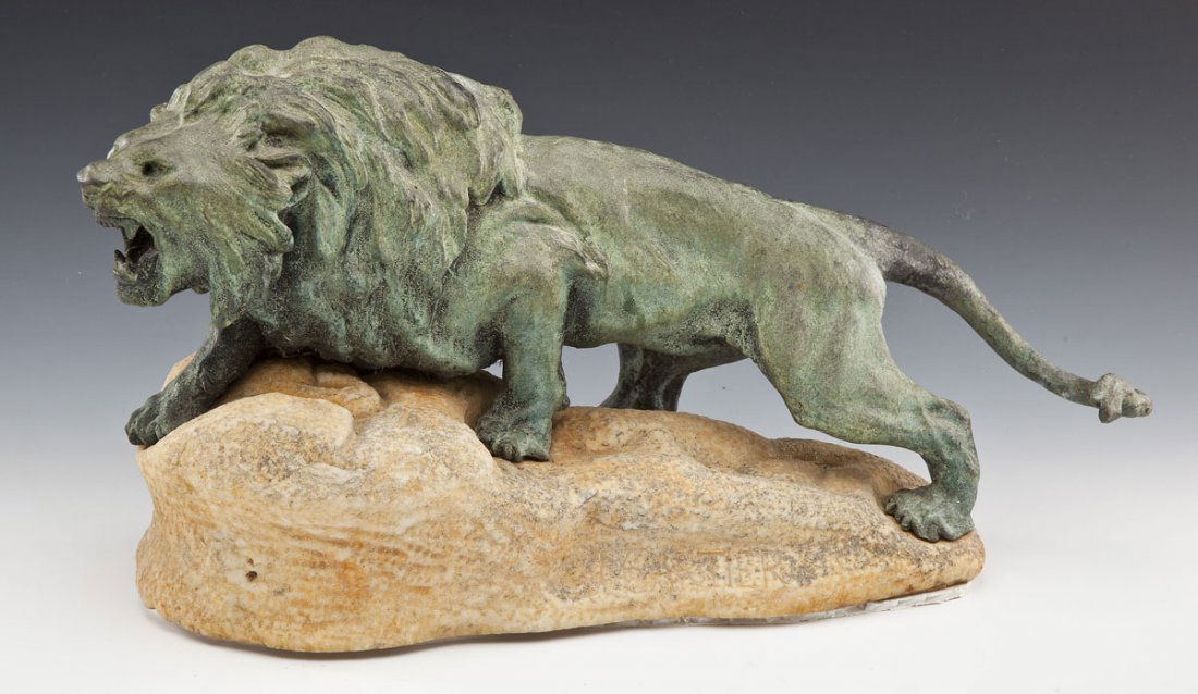 Thomas Francois Cartier (French, 1879-1943): DESCRIPTION: Thomas Francois Cartier (France, 1879-1943). Cast metal sculpture with bronze finish of a roaring lion upon a marble base. Signed "T. Cartier". Thomas Cartier studied at the École des Be