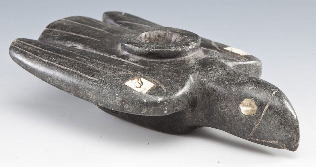 Northwest Coast Steatite Bird Effigy Pipe: DESCRIPTION: Northwest coast carved steatite bird effigy pipe. Inlaid bone or shell eyes and shoulders. MEASUREMENTS: 8-1/2" x 5-1/2" x 2-1/8". CONDITION: Minor wear to surface including scratches and