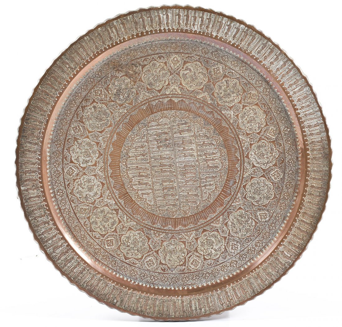 Persian Chased Copper Charger: DESCRIPTION: Persian chased copper charger. Depicts Assyrian figures parading around rim and in four registers in center. Figures surrounded by quatrefoils of birds and florals. MEASUREMENTS: 27" diam
