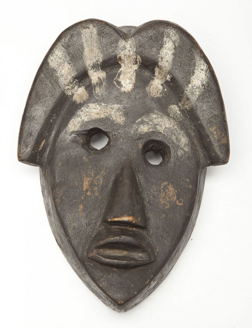 Ex-Segy Carved Wooden Dan Mask: DESCRIPTION: Carved wooden Dan mask with white painted features and crested coiffure with remnants of paint. 20th century. PROVENANCE: From the Saul and Florence Putterman Collection, Sarasota, Florid