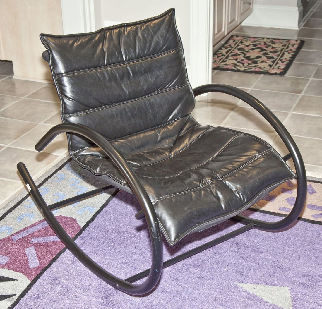 Tubular Rocker: DESCRIPTION: Metal tubular rocker with bent metal construction. Leather seat cushion. Labeled "Amisco Made in Canada". MEASUREMENTS: Overall 27" wide x 39" deep x 33" high at back. Seat 22" wide. COND
