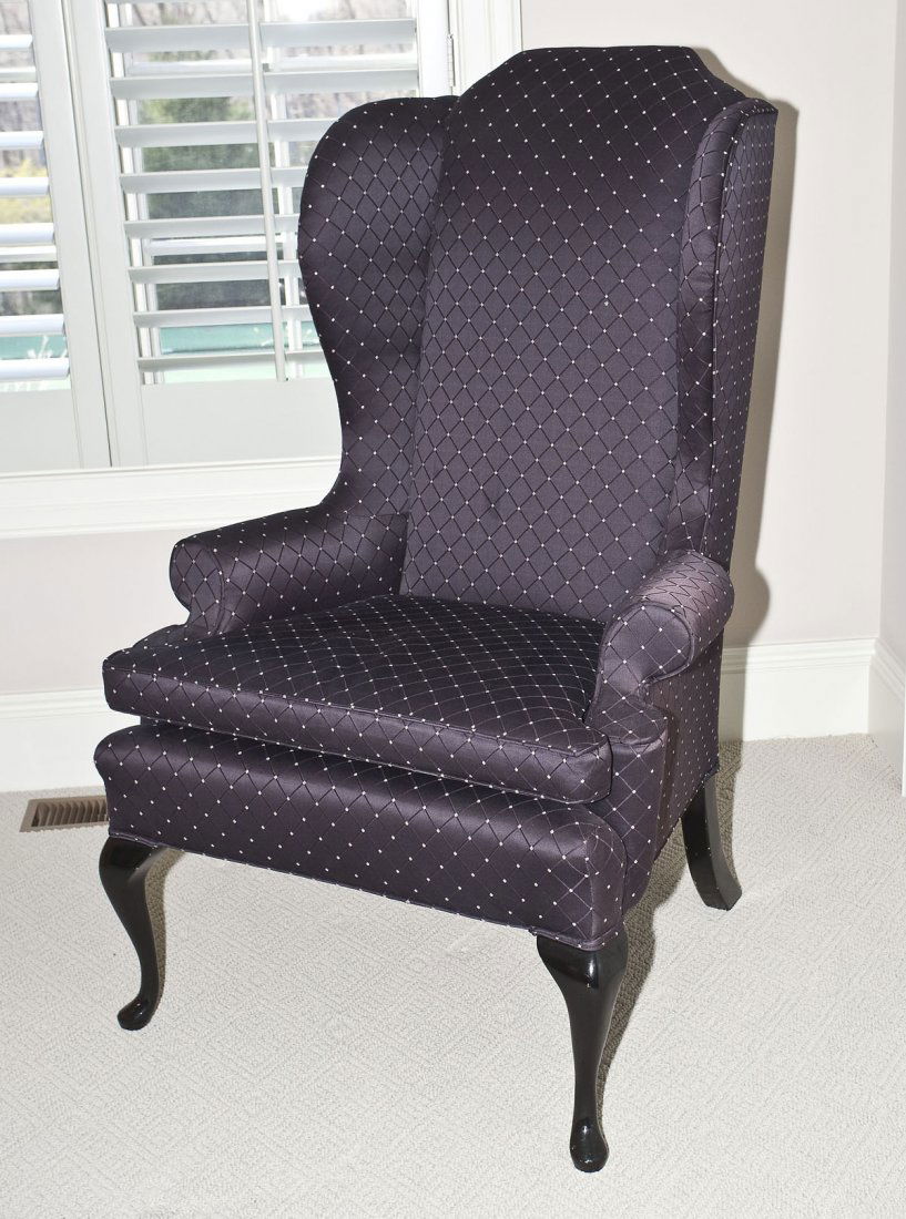 Wingback Chair: DESCRIPTION: Wingback chair with dark purple/black upholstery overall. MEASUREMENTS: Seat 20" x 28". 50" high at back. CONDITION: Very lightly used.