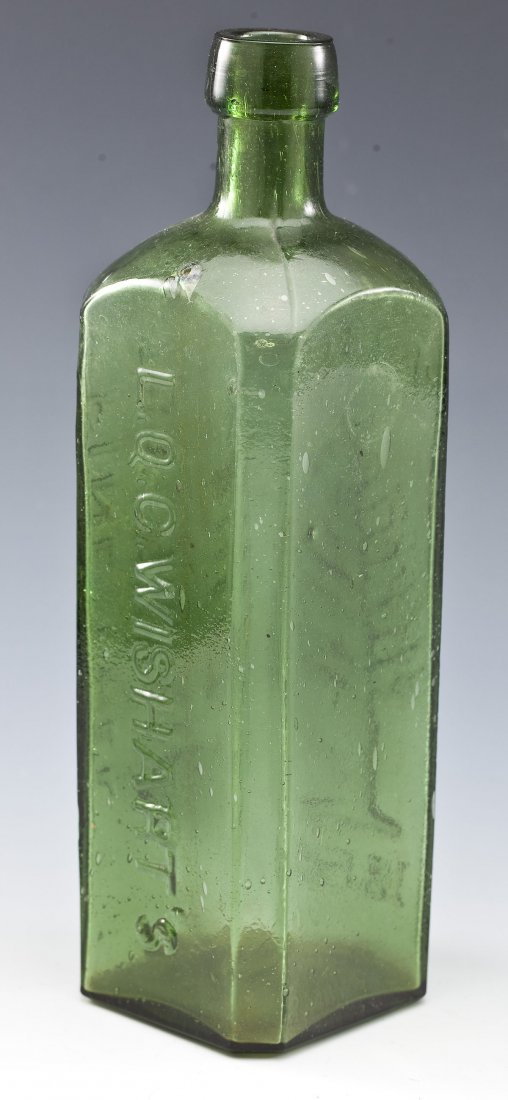 C 1859 Pine Tree Tar Cordial Medical Bottle: DESCRIPTION: Circa 1859 green square medical bottle. Marked vertically upon three panels "Patent 1859", "Pine Tree Tar Cordial, Phila", and "L. Q. C. Wishart's". MEASUREMENTS: 9-3/4" x 3" x 3". CONDIT