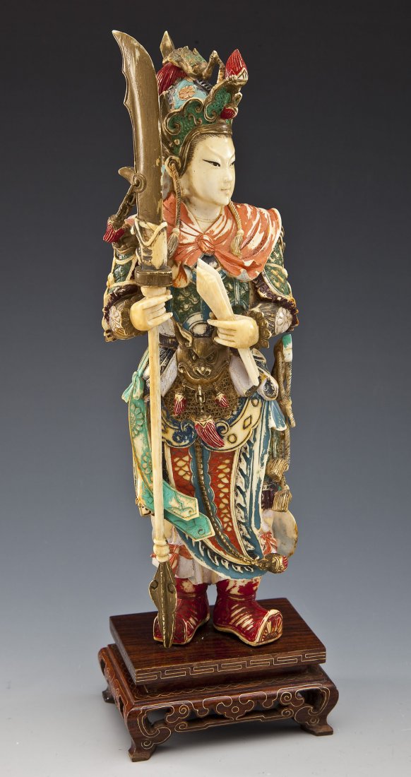 Carved & Polychrome Ivory Samurai: DESCRIPTION: Carved and polychrome ivory figure of a samurai with spear on carved wooden base and brass line inlay. MEASUREMENTS: 10" tall. CONDITION: Minor wear as expected with handling. IMPORTANT N