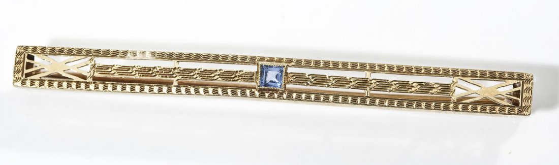 14K & Sapphire Deco Bar Pin: DESCRIPTION: Marked 14K yellow gold Deco bar pin set with one square cut sapphire. Hallmarked for Wordley, Allsopp and Bliss. MEASUREMENTS: 2-1/4" long. 2.6 dwt (4.0 gr). CONDITION: No defects noted.
