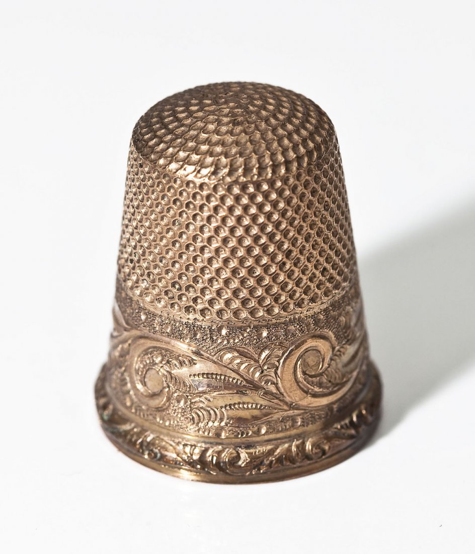 Gold Thimble: DESCRIPTION: Gold thimble with mark of two anchors. Possibly Stern Brothers. MEASUREMENTS: Size 8. 5 gr. 3.2 dwt. CONDITION: Minimal wear to surface consistent with handling. Minor wear to corners of 