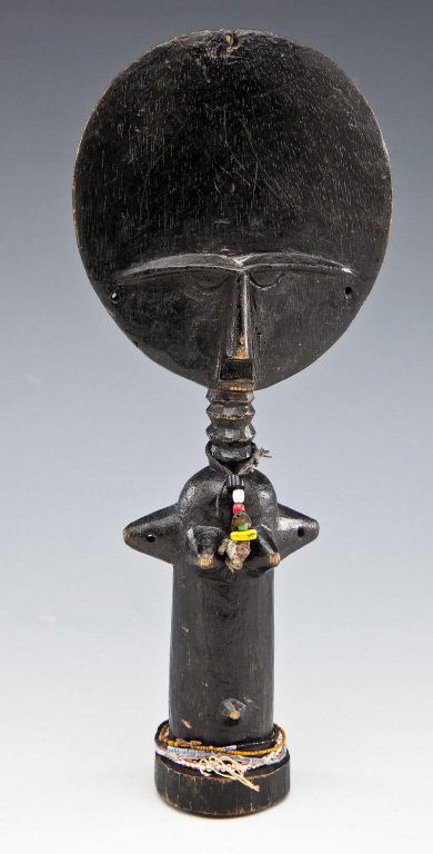 Ashanti Akuaba Fertility Figure: DESCRIPTION: Ashanti Akuaba fertility figure. Disc-shaped head, black lacquered surface, pole-shaped body, with beads and cording. PROVENANCE: From the Saul and Florence Putterman Collection, Sarasota