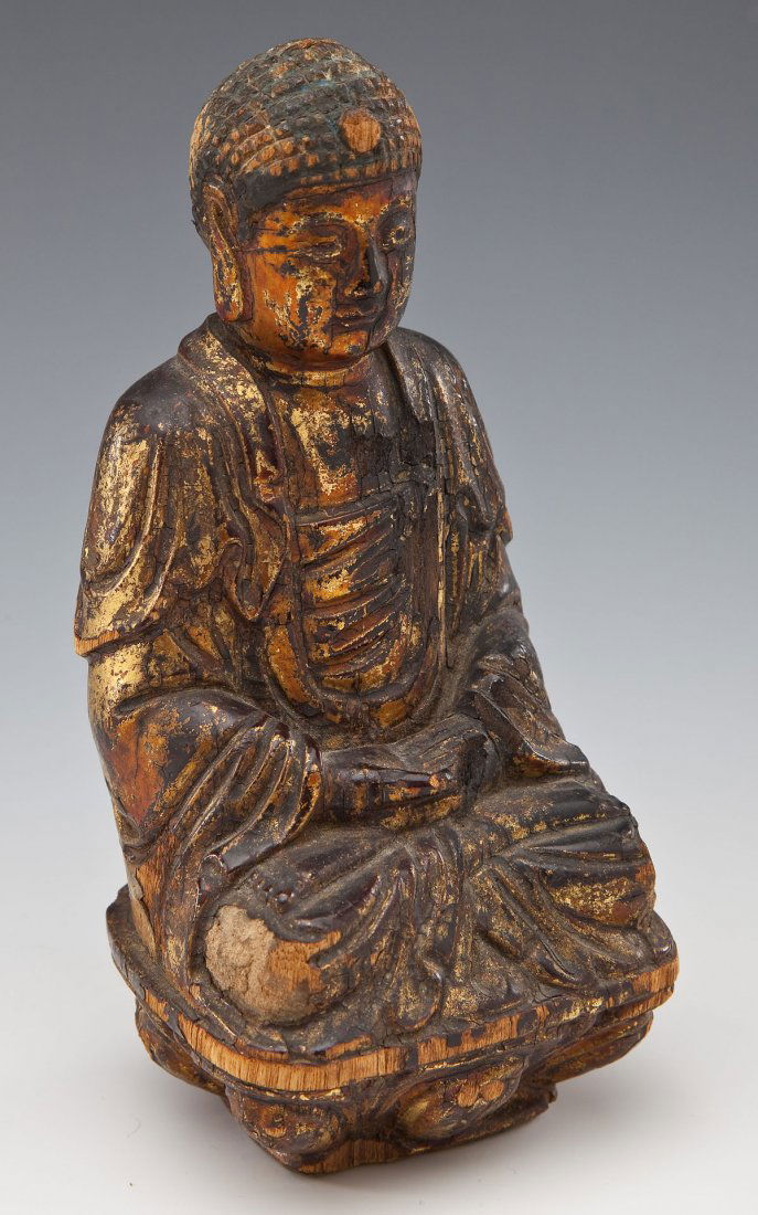 Qing Dynasty Chinese Buddha Carving: DESCRIPTION: Qing Dynasty carved and lacquered wooden seated Buddha. Signed upon the base. Qing Dynasty. MEASUREMENTS: 6-3/8" x 3" x 3". CONDITION: Wear and losses to paint as well as wood.